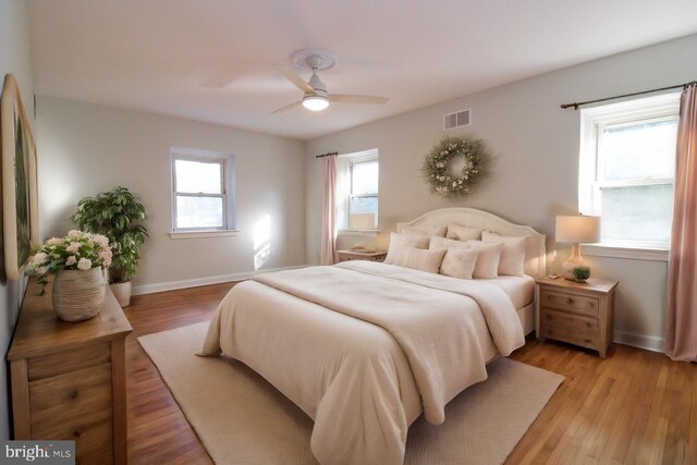 bedroom featuring ceiling fan and hardwood / wood-style flooring