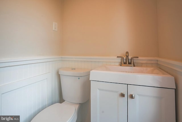 bathroom featuring toilet and vanity