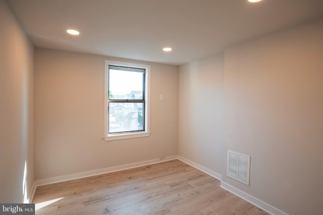 spare room with light wood-type flooring