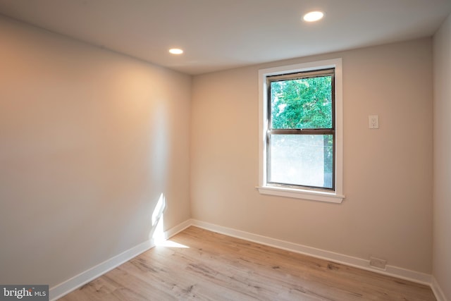 unfurnished room featuring light hardwood / wood-style floors