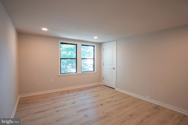 unfurnished room featuring light hardwood / wood-style floors