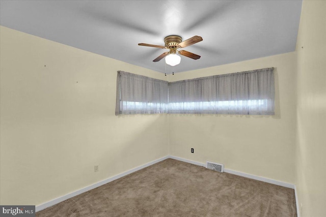 carpeted empty room with ceiling fan