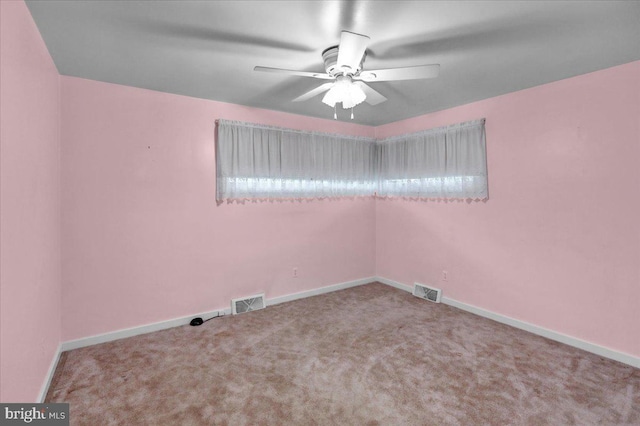 spare room with ceiling fan and carpet floors