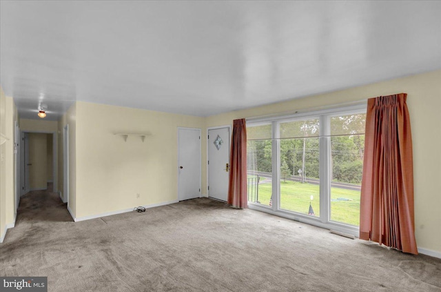 unfurnished living room with light colored carpet