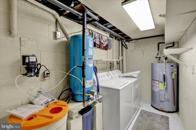 washroom featuring independent washer and dryer and electric water heater