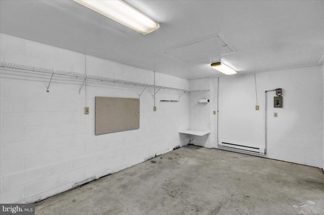 garage featuring a baseboard heating unit