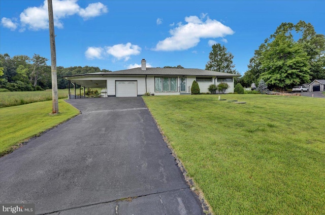 ranch-style home featuring a garage, a carport, and a front yard