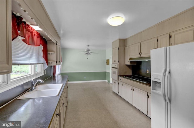 kitchen featuring sink, ceiling fan, and white appliances