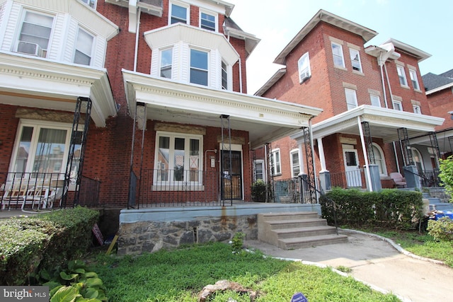 view of property featuring a porch