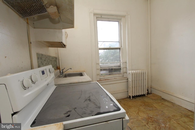 laundry room with radiator, sink, washer / clothes dryer, and light tile patterned flooring