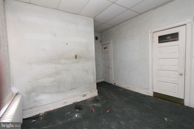 spare room featuring a drop ceiling