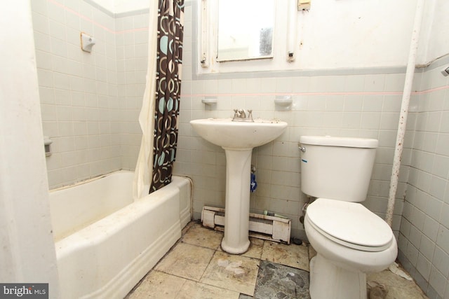 bathroom featuring shower / tub combo, baseboard heating, toilet, tile patterned floors, and tile walls