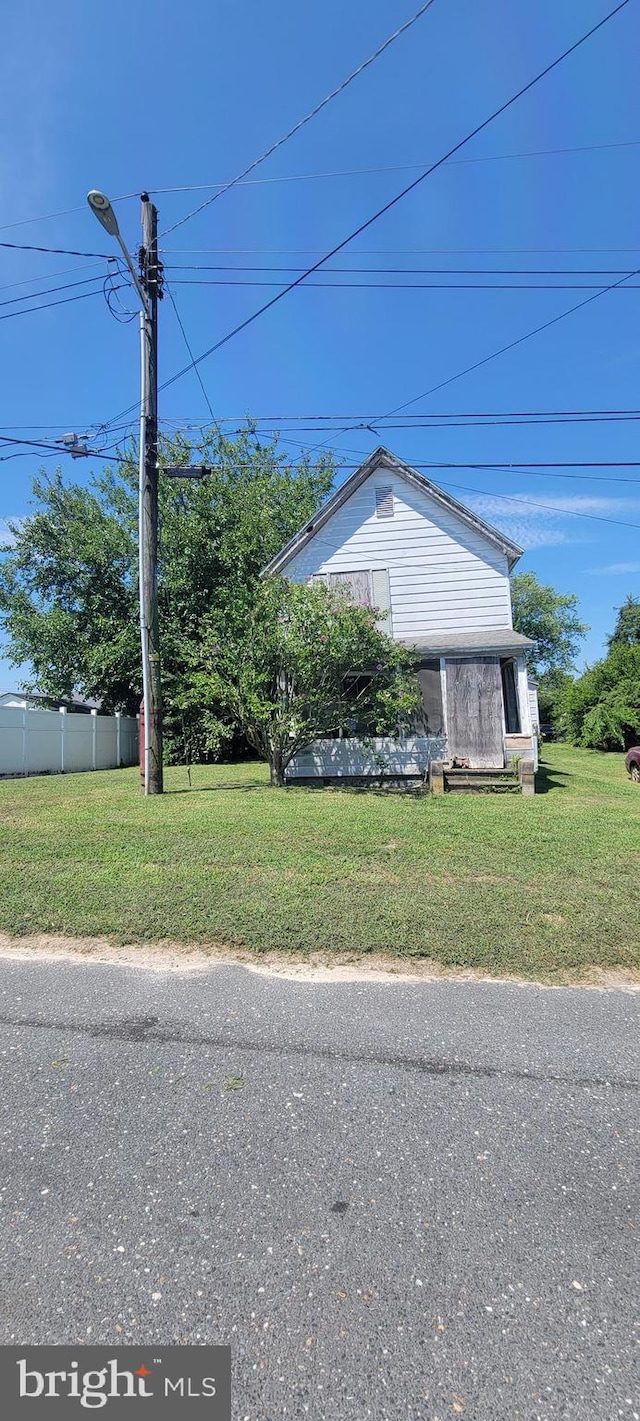 view of home's exterior featuring a yard