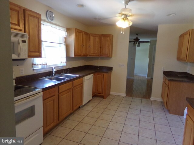 kitchen with sink, light tile patterned flooring, ceiling fan, and white appliances