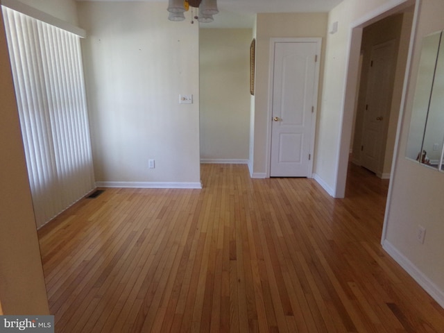 unfurnished room with light hardwood / wood-style flooring