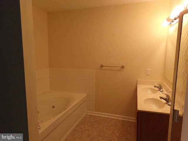 bathroom with vanity and a bathtub