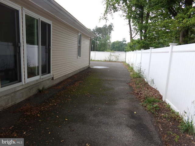 view of side of home with a patio