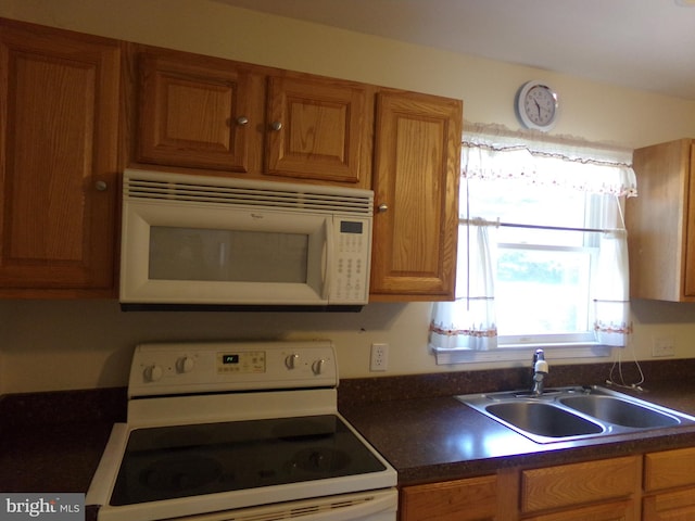 kitchen with white appliances and sink