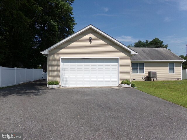 garage with a yard