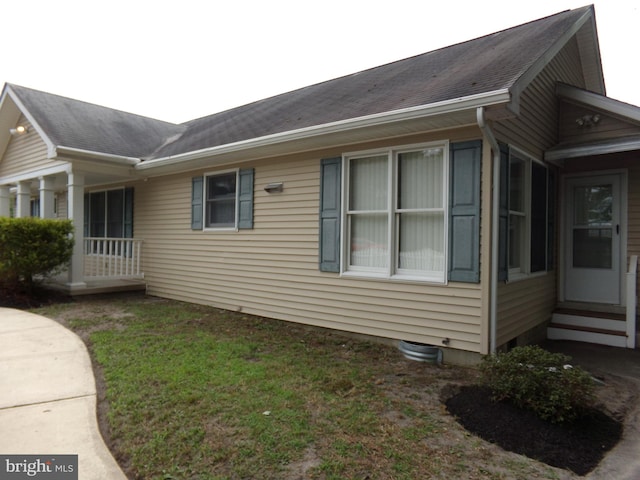 view of home's exterior featuring a yard