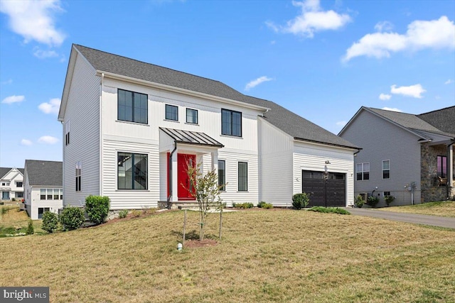 view of front facade featuring a garage and a front yard