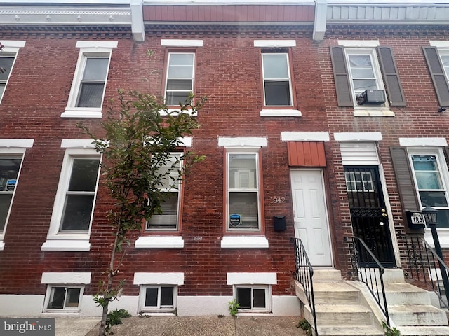 view of front of property with cooling unit