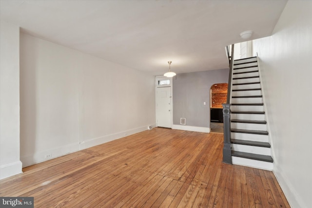 unfurnished living room with hardwood / wood-style flooring