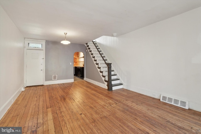 unfurnished living room with hardwood / wood-style floors