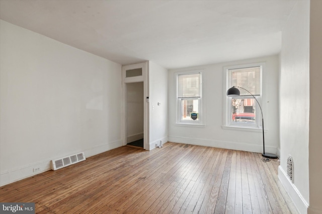 spare room with light hardwood / wood-style floors