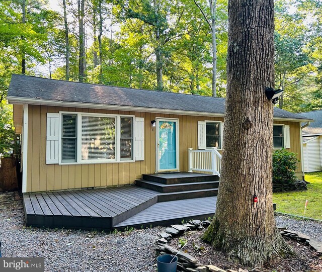 ranch-style home with a deck