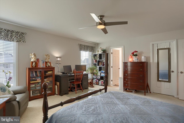 carpeted bedroom featuring ceiling fan