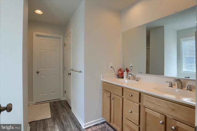 bathroom with vanity and hardwood / wood-style floors