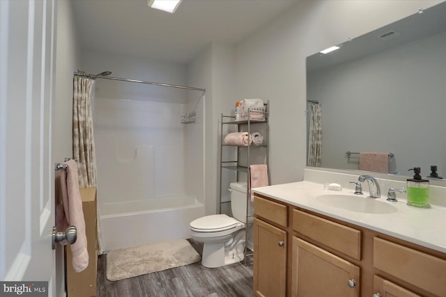 full bathroom featuring vanity, hardwood / wood-style floors, toilet, and shower / bathtub combination with curtain