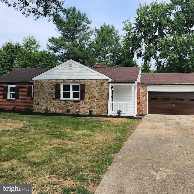 single story home with a garage and a front yard