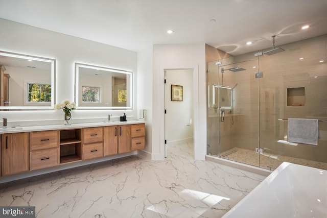 bathroom with vanity and independent shower and bath