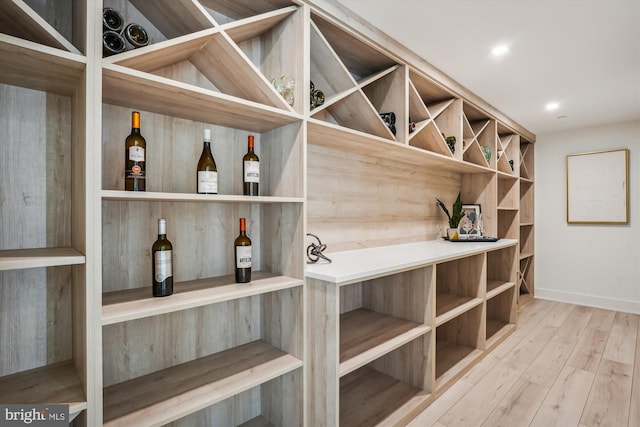 wine area with wood-type flooring