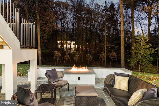 view of patio / terrace with an outdoor fire pit