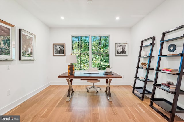 office area with light hardwood / wood-style flooring