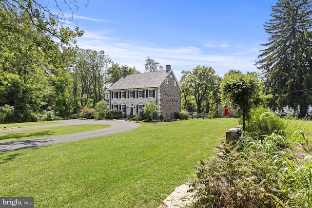 exterior space featuring a front lawn