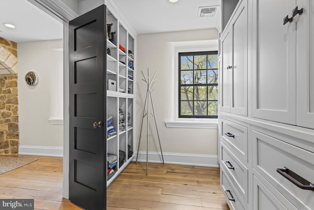 spacious closet with light hardwood / wood-style floors