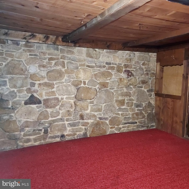 basement featuring carpet flooring and wooden ceiling