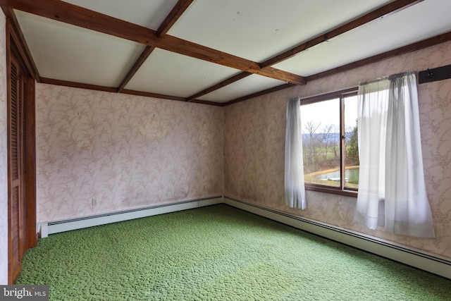 empty room featuring carpet and beam ceiling