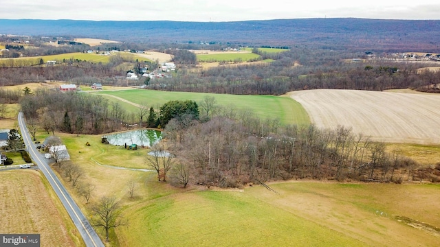 birds eye view of property with a rural view