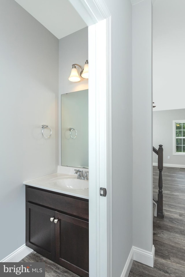 bathroom with vanity and hardwood / wood-style flooring