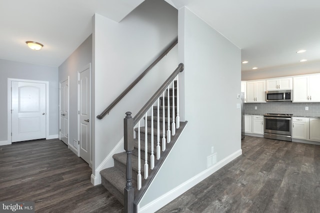 stairway featuring hardwood / wood-style flooring