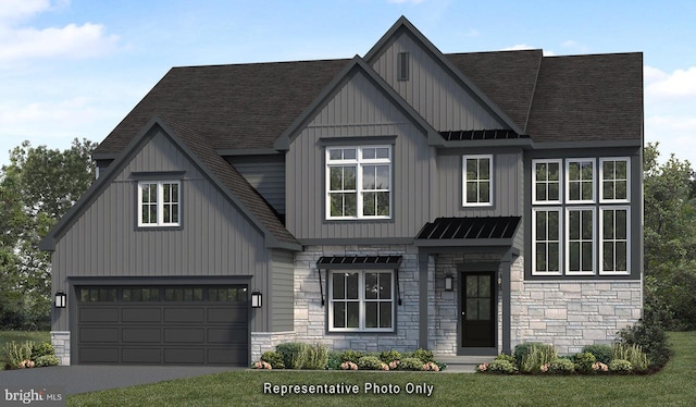 view of front of property featuring a front lawn and a garage