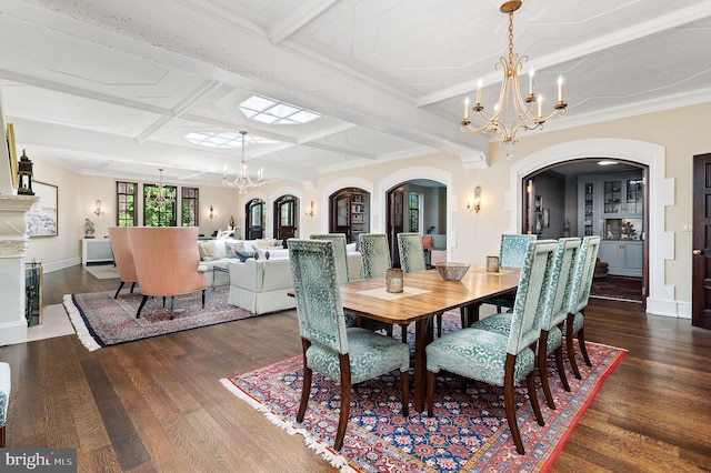 dining area featuring coffered ceiling, crown molding, dark hardwood / wood-style floors, a notable chandelier, and beamed ceiling