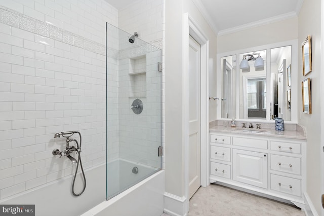 bathroom featuring ornamental molding, vanity, and bath / shower combo with glass door