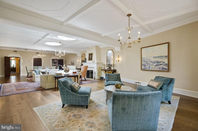 living room with an inviting chandelier, hardwood / wood-style flooring, beam ceiling, and coffered ceiling