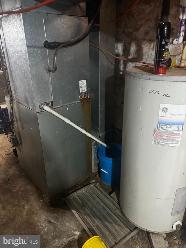 utility room with water heater and heating unit